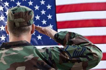 Air Force SMSgt saluting flag